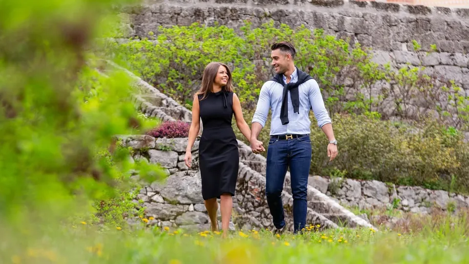 Couple in love strolling through a green park